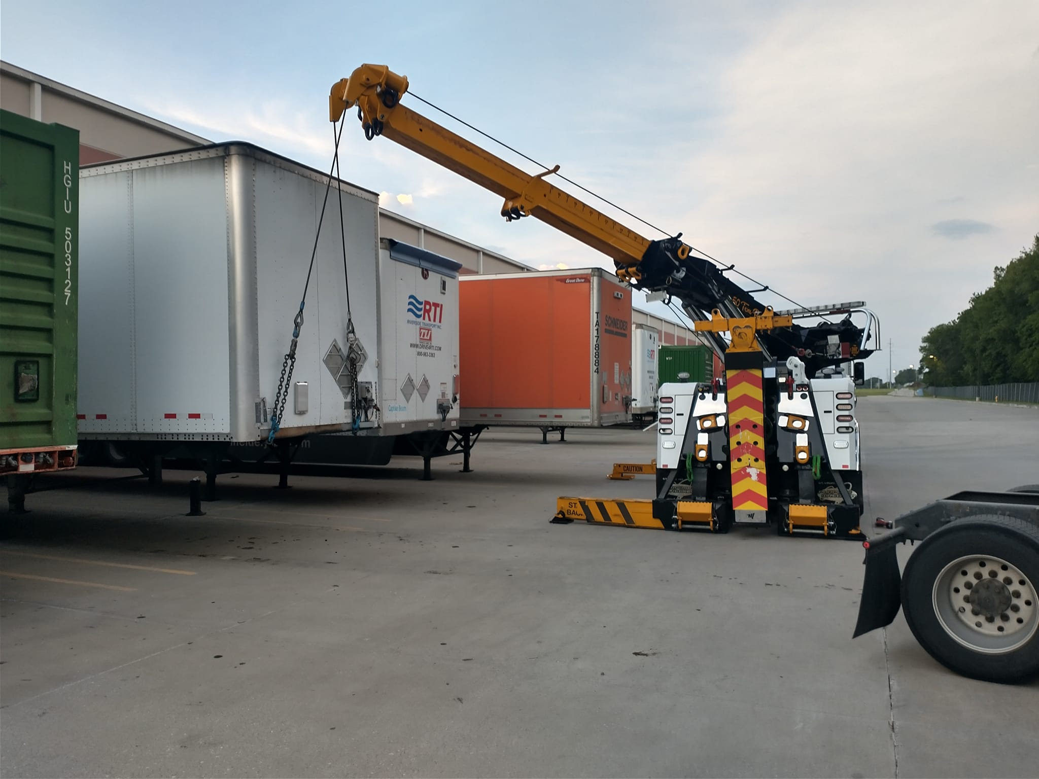 crane truck lifting freight container