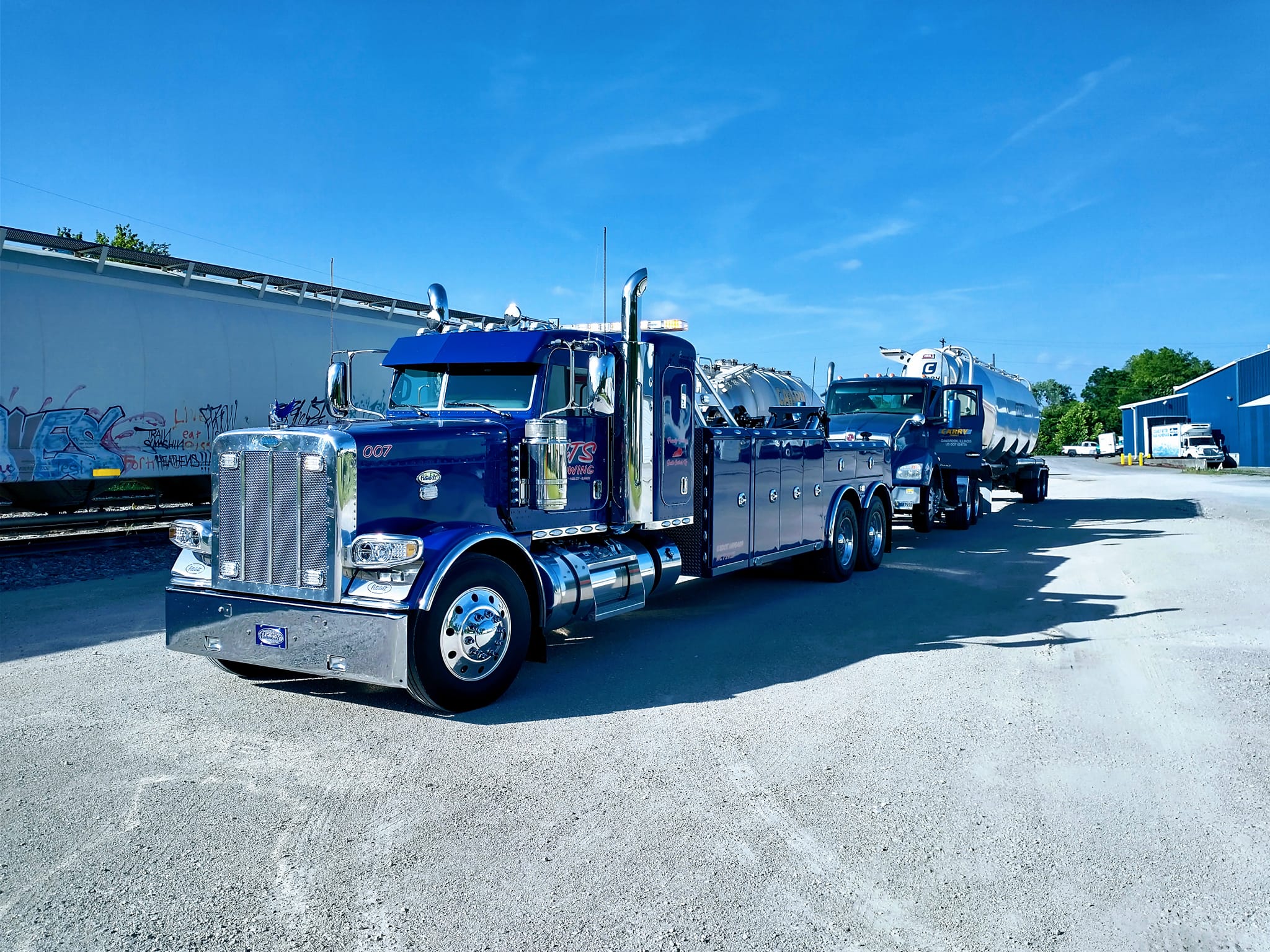 blue truck hauling natural gas truck